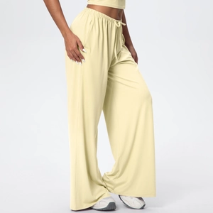 Detail of high-waist elastic drawstring waistband on cream wide-leg lounge trousers