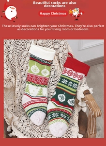 Close-up of knit Christmas stockings with snowflake and tree patterns in red and green