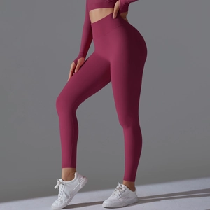 Detail view of high waist seamless yoga pants with wide ribbed waistband in berry color