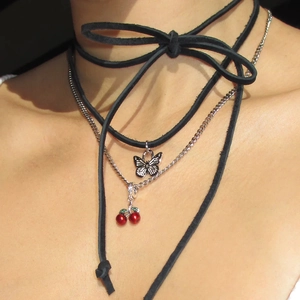 Three-layer layered necklace with black bow, butterfly charm and red cherry pendant