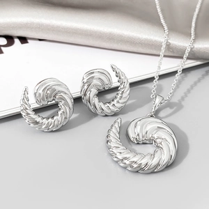 Silver twisted rope jewelry set including croissant style necklace and matching earrings