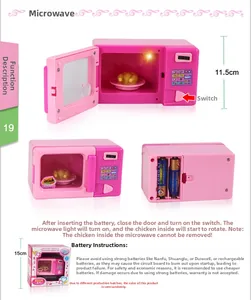 Pink toy microwave with internal rotating tray and light for kids kitchen pretend play