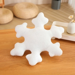 Plush white snowflake pillow made of soft teddy fleece fabric for home decor