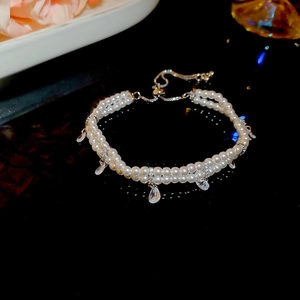 Detail of double-layer pearl bracelet with water drop zircon and adjustable drawstring clasp