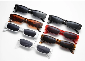 Flat lay of retro square sunglasses collection in multiple colors and resin frames