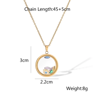 Detail shot of a gold-plated evil eye necklace with dimensions 2.2cm and 3cm marked