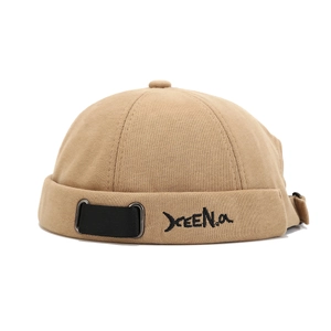 Khaki cotton docker cap with letter embroidery and black strap decoration on white background