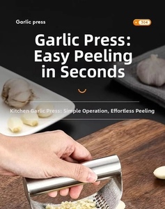 Close-up of 304 stainless steel rocker garlic press on wooden board with minced cloves