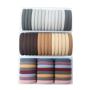 Three-box set of colorful elastic flocking hair ties for ponytails in minimalist style