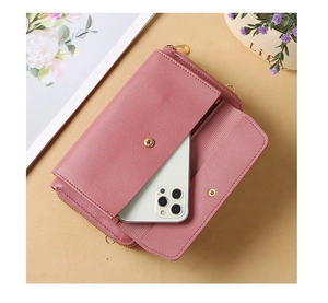Detail view of pink PU leather crossbody phone bag with gold hardware and compartments