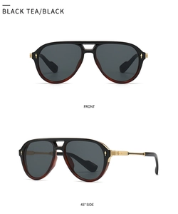 Macro detail of pilot sunglasses with gold hinges and black tea translucent frame