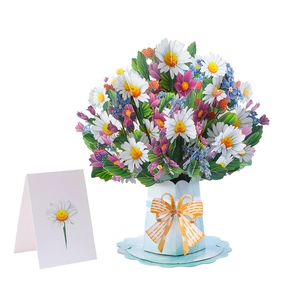 Macro view of 3D pop-up bouquet card with daisies and wild flowers in blue paper vase