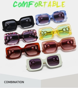 Detail view of square sunglasses with colorful patterns and unique chain link temple design
