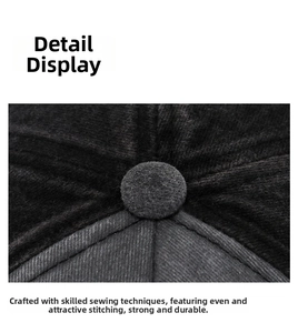 Close-up of the vintage baseball cap top button and fine stitching on distressed fabric