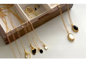 Gold knotted jewelry set with freshwater pearls and assorted clip-on earring styles