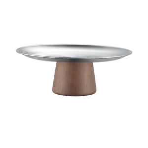 Close-up of modern silver metal top tray with a stable brown wooden cone base