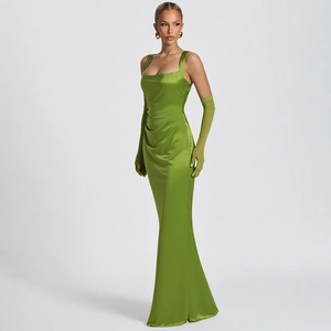 Detail of elegant green satin fishtail dress with matching long gloves and slim-fit corset