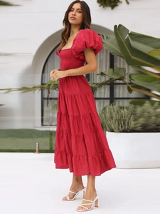 Detail of red off-shoulder puff sleeve summer dress with tiered skirt and ruched bodice