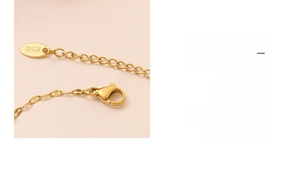 Detail of 18k gold plated stainless steel chain with lobster clasp and K18 hallmark tag