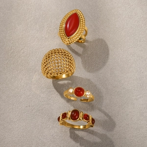 Set of four gold plated stainless steel rings with red agate stones for a luxurious look