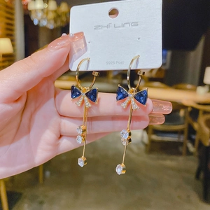 Elegant gold-tone long drop earrings with blue crystal bow and dangling stones on S925 post