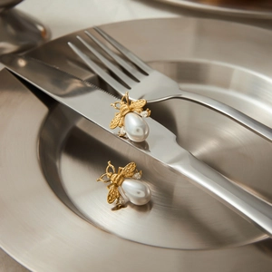 Elegant gold bee earrings with teardrop pearls and crystals on stainless steel plates