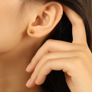 Fashionable golden bean stud earrings with irregular texture and minimalist round design