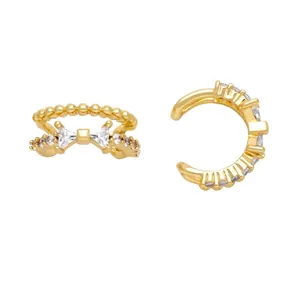 Gold plated cubic zirconia ear cuffs set featuring bow and curved sparkling crystal designs