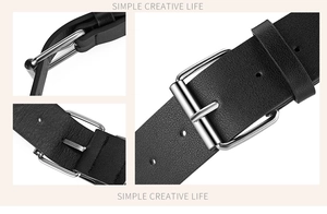 Détails de la ceinture en cuir grainé noir avec boucle argentée et coutures de précision