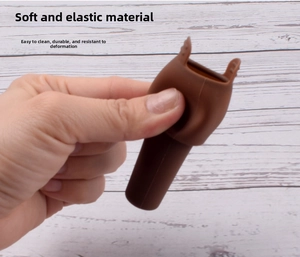 Brown silicone wine stopper showing flexible and durable material with easy grip handle