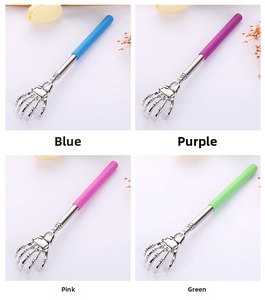 Detail of colorful skeleton hand back scratchers with telescopic handles in four vibrant colors