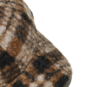 Close-up of thick plaid faux fur texture on a warm winter vintage baseball cap