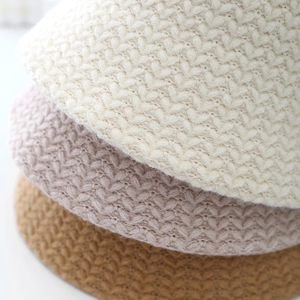 Chic knit bucket hats in beige, pink, and camel with classic herringbone texture details