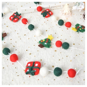 Christmas wool felt garland with reindeer tree and gift box ornaments on white stars background