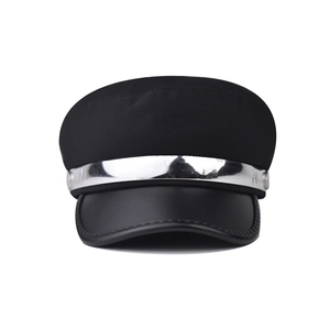 Detail of black baker boy hat with silver metallic bar and M-engraved side buttons