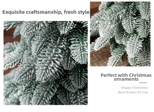 Detailed view of dense PE pine branches with realistic snow flocking on a green tree