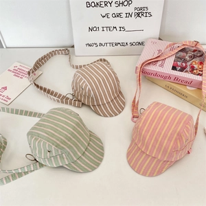 Detail of mini 5-panel cap crossbody bags with vintage stripes and metal hardware