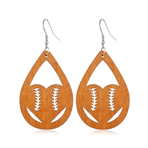Detail of teardrop wooden earrings featuring hollow baseball stitch patterns and metal hooks