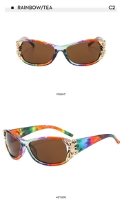 Close-up of rainbow frames with tea lenses and metal butterfly hinge details