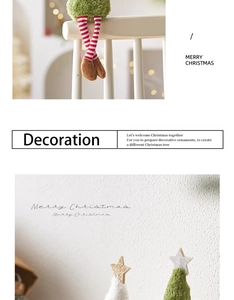 Close-up of plush Christmas tree and long-legged dolls with Merry Christmas text details