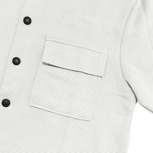 Detail of heavy twill fabric texture with square flap pocket and matte dark buttons