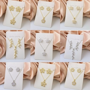 3D heart and clover pendant necklace and stud earring sets in gold and silver plating