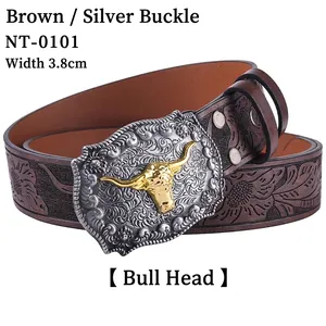 Detail of western cowboy belt with embossed brown leather and silver bull head buckle