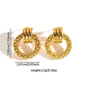 Detail view of gold titanium earrings with dimensions 2.92cm height and 5.2g weight