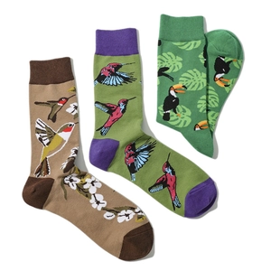 Detailed knit of cotton crew socks featuring bird, hummingbird, and leaf embroidery