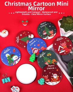 Flat lay of colorful Christmas themed portable round pocket mirrors with festive patterns