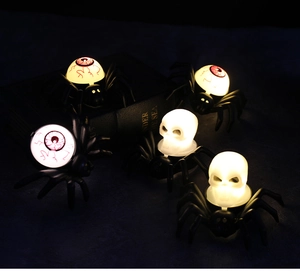 Halloween LED candle lights with spider base, red bloodshot eyeball, and skull decoration