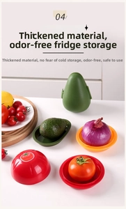 Close-up of tomato, onion and avocado shaped plastic food storage containers in a kitchen