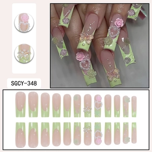 Long coffin press-on nails with green French tips, 3D camellia flowers and pearl bows