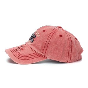 Detailed view of the distressed washed denim cap with vintage 3D MT embroidery